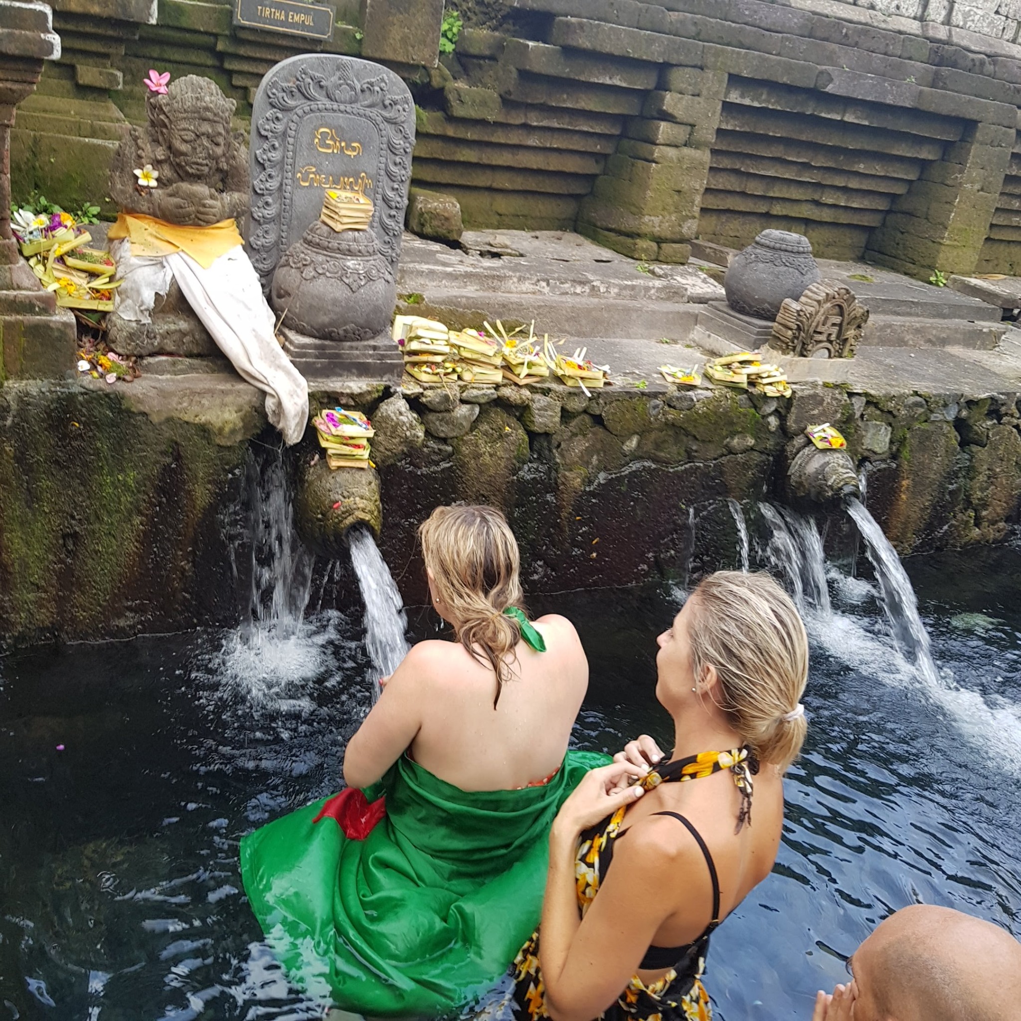 Visitors at the purification fountains of Tirta Empul in Bali